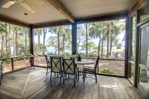rustic-porch-with-forest-and-waterfront-view-PFFES9X